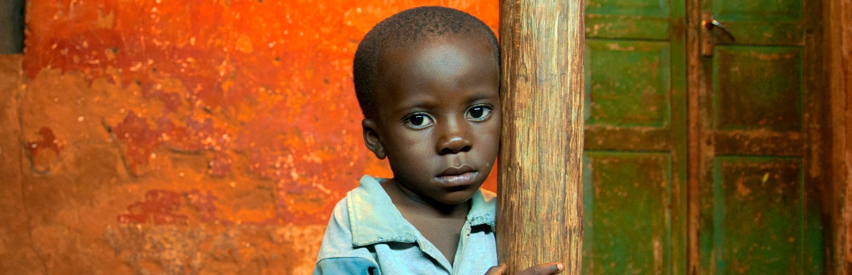 Portrait of a young pre-school boy, age three, in Tanzania. This young child grandmother hopes he will one day be able to attend school and break the cycle of poverty in which he’s grown up. Photo Credit: Colin Crowley/Save the Children, December 2010.