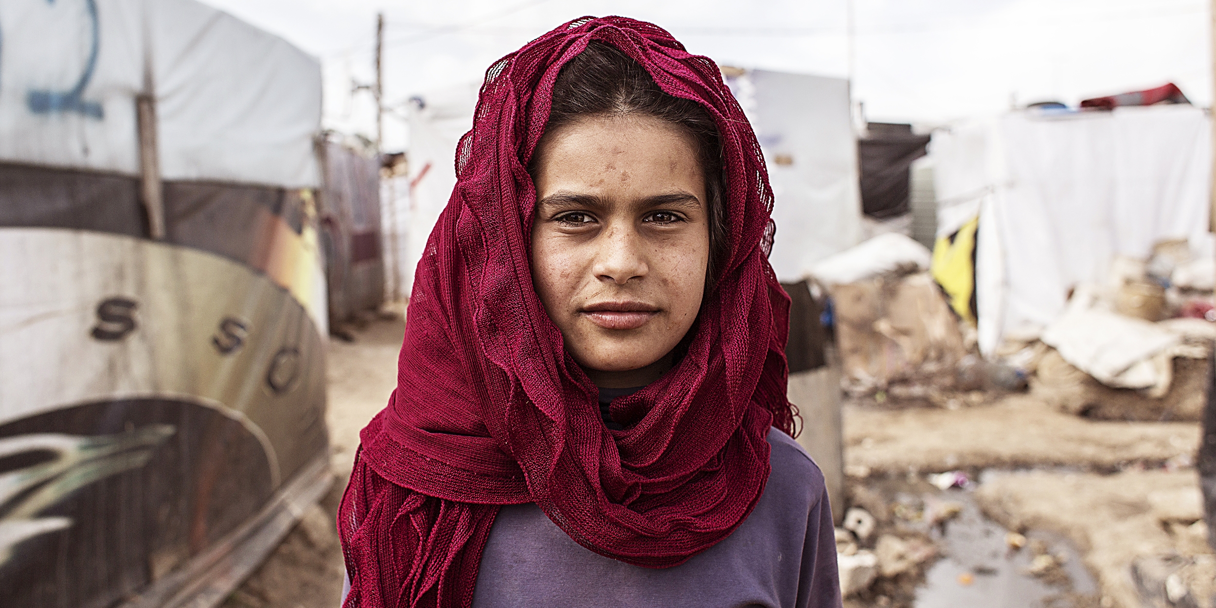 A 12-year-old Syrian girl, in the Anjar Refugee camp in Lebanon. Save the Children offers programs in the camp to help keep refugee children healthy, educated and safe.  