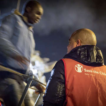 Approximately 400 migrants were brought to the port of Augusta, in Sicily, by the Italian naval ship, Libra. Save the Children estimates that approximately 9,500 migrants have arrived at the southern border of Italy since the beginning of 2015. Of those, close to 1,000 were women and approximately 900 were children, most of them unaccompanied. Photo credit: Hedinn Halldorsson/Save the Children 2015.  