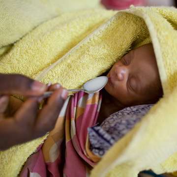 An eleven-day-old baby is cared for with help from a grant from the Bill and Melinda Gates Foundation. The babies were born one week premature and one weighed 4.1 pounds and the other 4.4 pounds. Photo Credit: Joshua Roberts/Save the Children 2010.