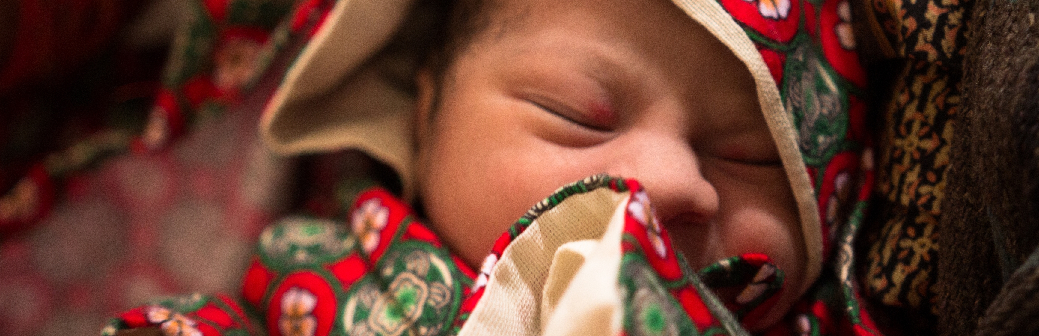 A newborn baby girl in Nepal – only a few minutes old – dressed in warm clothes to prevent hyperthermia. Photo credit: David Wardell/Save the Children, March 2014.