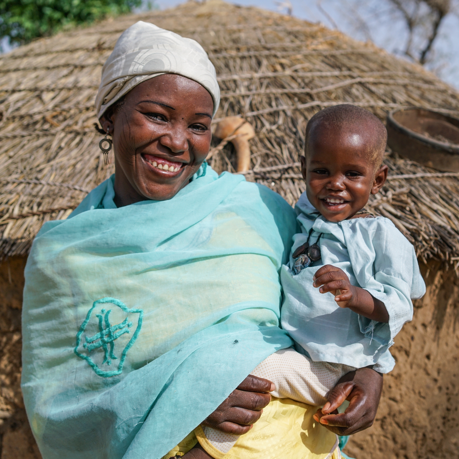 Rabiou and mother Fatima at home in their village in Niger. Photo Credit: Talitha Brauer/Save the Children, 2016.