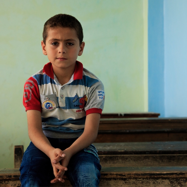 Rami*, 9, at a Save the Children-supported school in northern Syria. Rami* and his family were forced to flee their home in Syria due to the conflict. Photo credit: Ahmad Baroudi/Save the Children 2015.