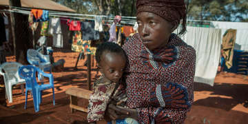 A mother of four young children fled Burundi as violence escalated. They arrived in a refugee camp in Tanzania with no belongings or money – just the clothes they were wearing – because the militia stole the money she had. They are all suffering from malnutrition and are being treated at the therapeutic feeding clinic. Photo credit: Tom Pilston/Save the Children, July 2015. 