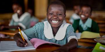 A girl of 9 studies at her school in Uganda. Photo Credit: Jordan J. Hay/Save the Children 2012.