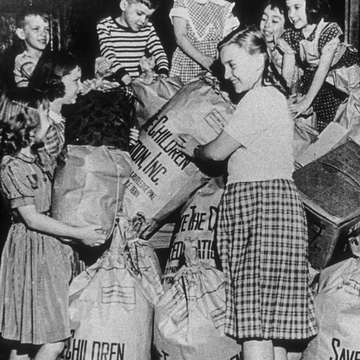 Save the Children's first annual “Bundle Days” campaign was organized in Knoxville, Tennessee 1941, where volunteers refurbished and distributed donated clothing to needy children in the United States and war-affected Europe. Photo Credit Save the Children Archive 1941.