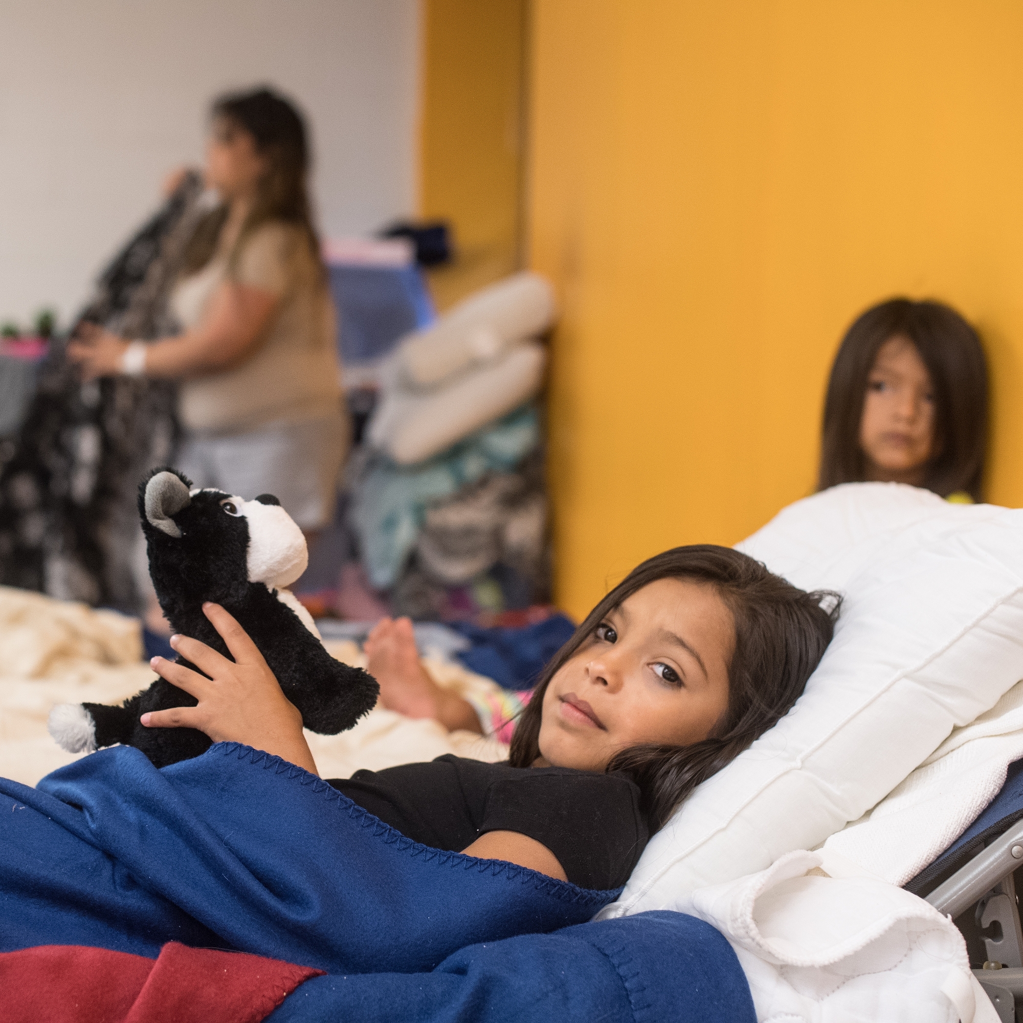 A 9 year-old girl is of 16 extended family members who evacuated together to the shelter for hurricane Harvey. All the children have been attending the Save the Children child-friendly space set up in the shelter. Photo Credit: Susan Warner/Save the Children 2017.