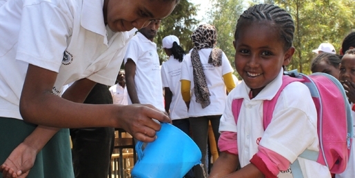 Girl in Ethiopia washing her hands at school