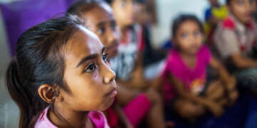 Children including Angelita attends a Save the Children 'reading camp', a programme that aims to boost literacy rates, at a STC-funded model primary school in West Sumba, Indonesia. 
