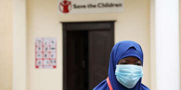 Hibo, a young female student, wears her mask at a Save the Children facility in Somalia, Africa.