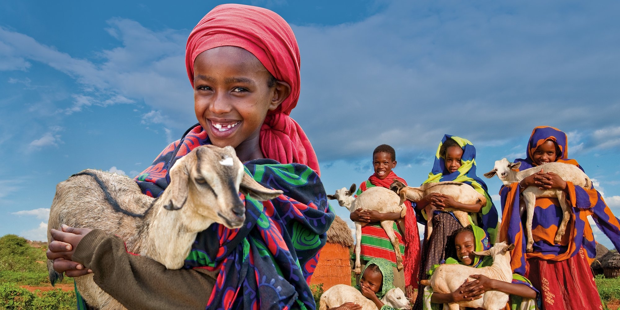 A young Ethiopian girl holds her precious goat to support the Save the Children Gift Catalog. Photo Credit: Gary Dowd/Save the Children 2010.