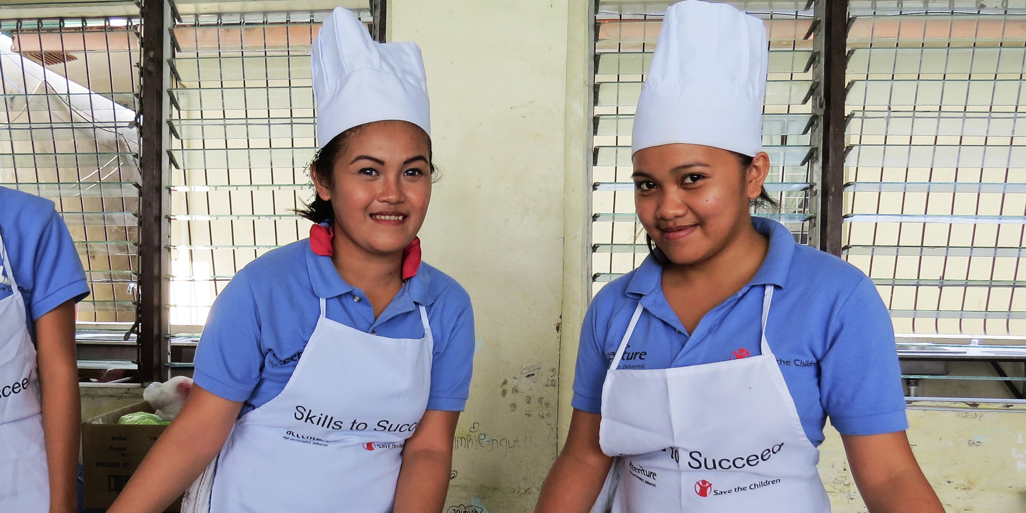 Two Indonesian girls cooking.