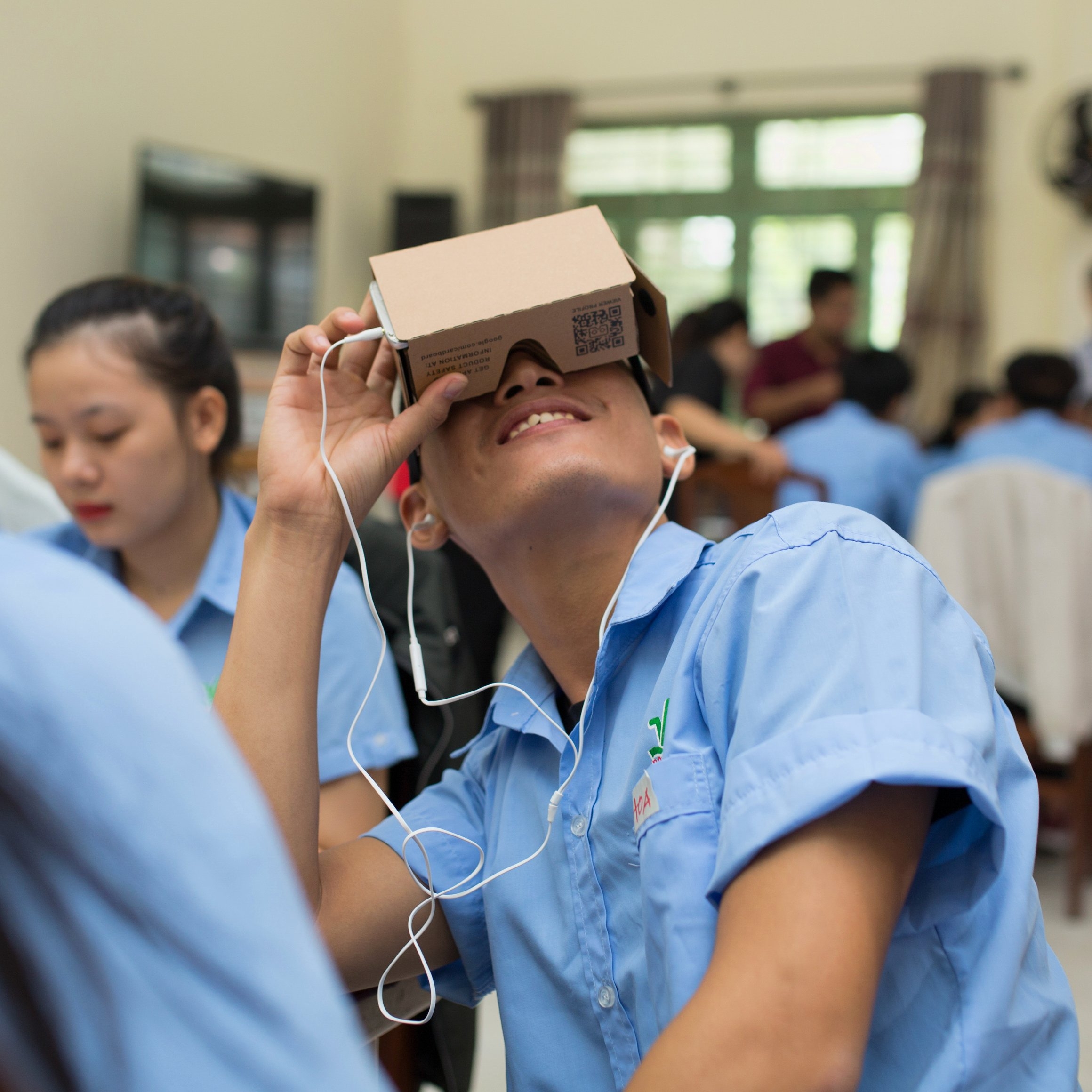 Children in Vietnam get a glimpse at technological innovation. Photo credit: Accenture/Save the Children 2018.