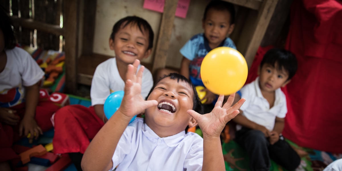 Children playing and learning at a Save the Children reading club in  Mindanao, Philippines.
