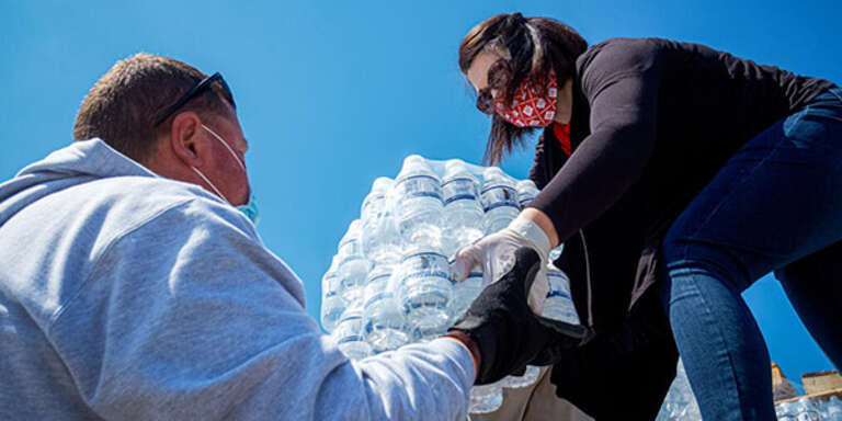 Save the Children staff and volunteers unload water to Kentucky families in rural America in repsonse to severe storms that left many families without power for several days. Shawn Millsaps, April 15, 2020.