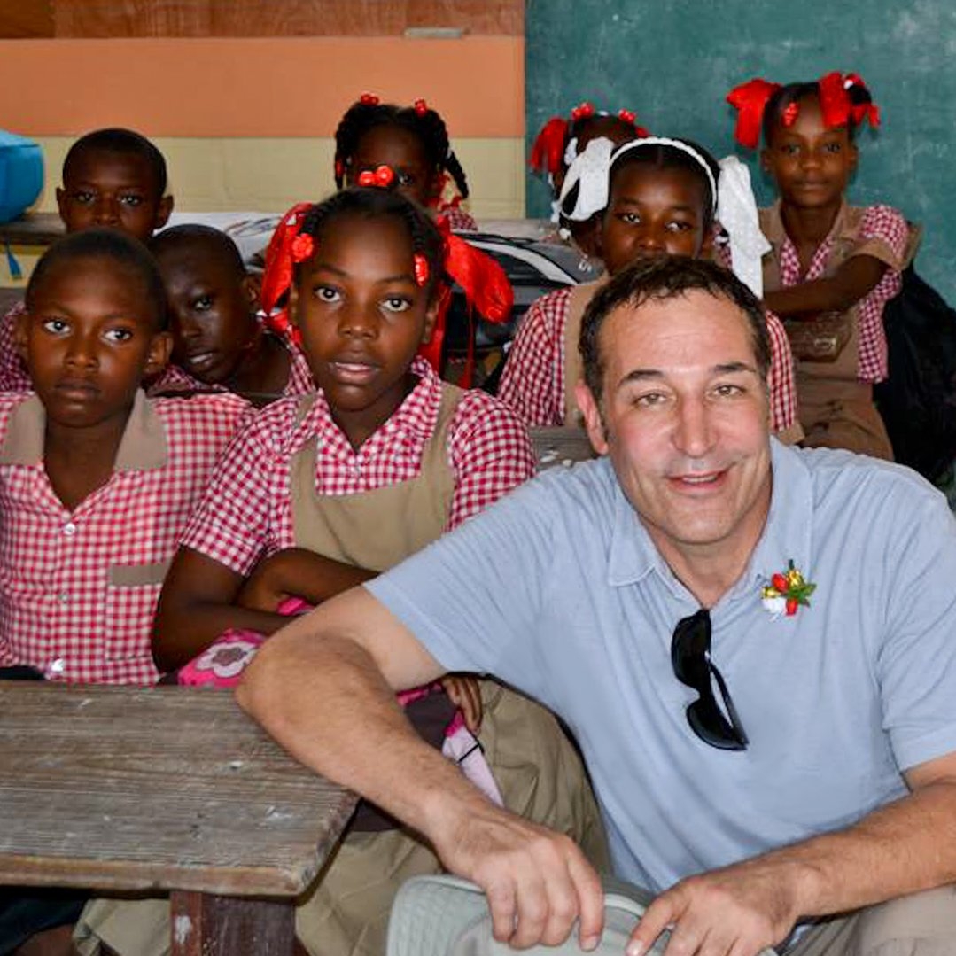 Sam Simon at a school in Haiti after the Earthquake. Photo Credit: Save the Children 2015.