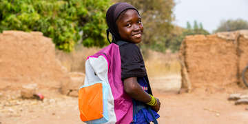 A girl with a backpack.