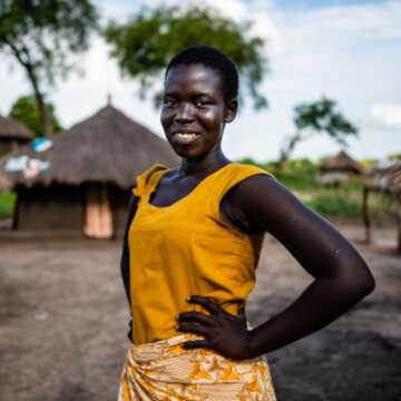 “When a girl child is given a chance, she can do what a boy child can do,” says 14-year-old Harriet. In a refugee settlement in Uganda this confident, smiling student is showing just what girls are capable of. Photo credit: Louis Leeson / Save the Children 2019.
