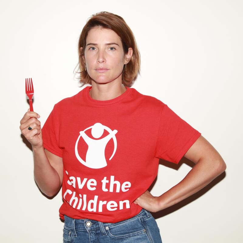 Cobie Smulders, Save the Children Ambassador, holds a red fork in support of Save the Children's Get Fed Up campaign.