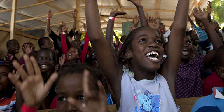 Children take part in activities at a safe-play area supported by Save the Children in Lamentin 54, Carrefour, Port au Prince, Haiti.  Much of Port au Prince was destroyed in the devastating earthquake in January 2010, which killed over 230,000 people and left more than one million homeless.
