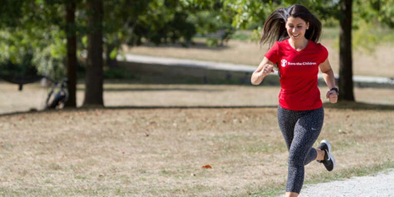 Woman running wearing Save the Children shirt