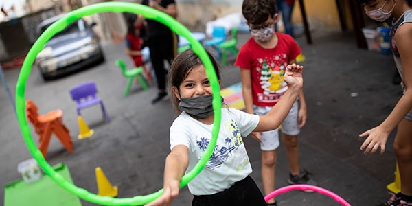 Children in Beirut, Lebanon play in a child safe space sponsored by Save the Children