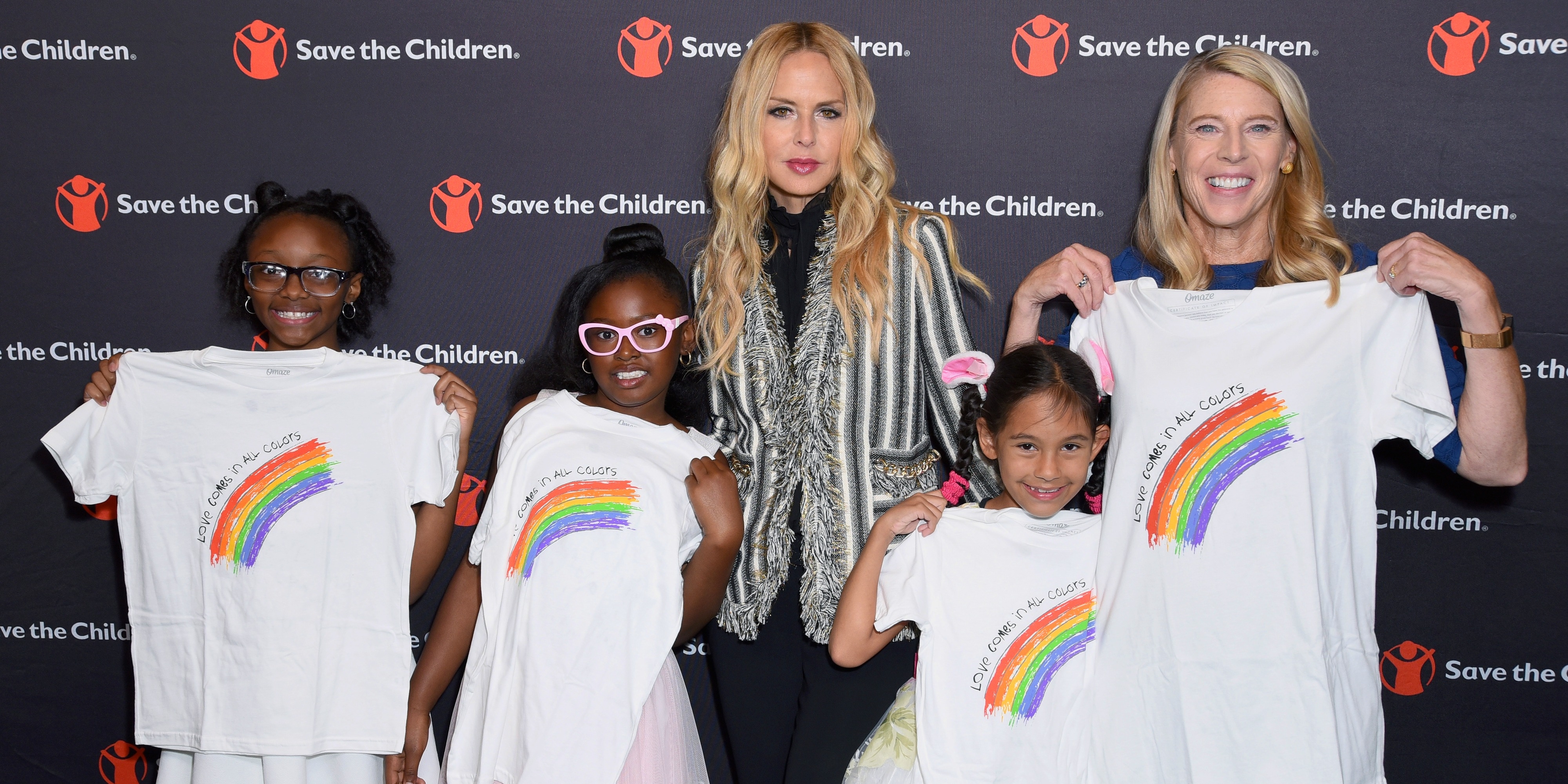 Artist Ambassador Rachael Zoe poses for a photograph with Save the Children President Carolyn Miles and children at the Illumination Gala. Photo credit: Save the Children, 2018.