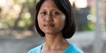 Meet Anna, who loves football and is living in Thailand after her mother emigrated to Thailand.