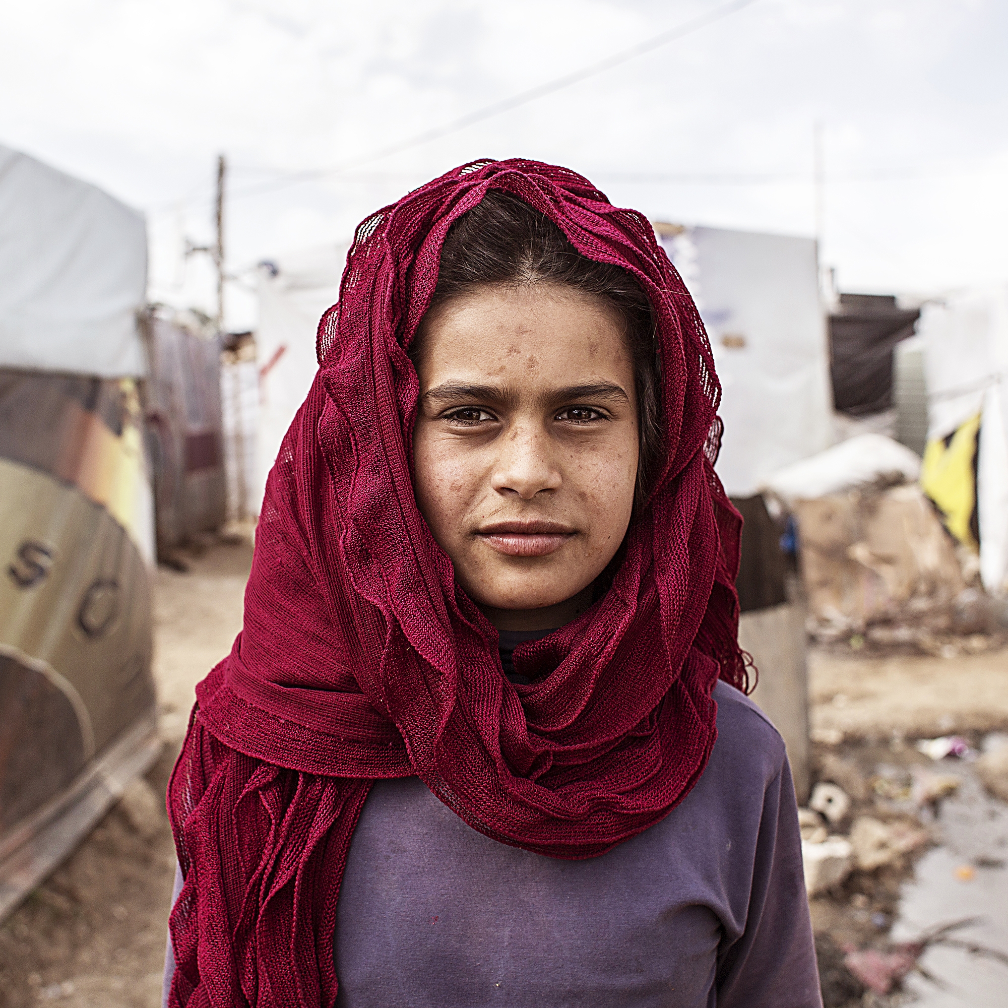 A 12-year-old Syrian girl, in the Anjar Refugee camp in Lebanon. Save the Children offers programs in the camp to help keep refugee children healthy, educated and safe.  