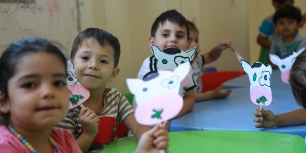 Young children participate in an activity as part of Save the Children's early childhood care and development programming.