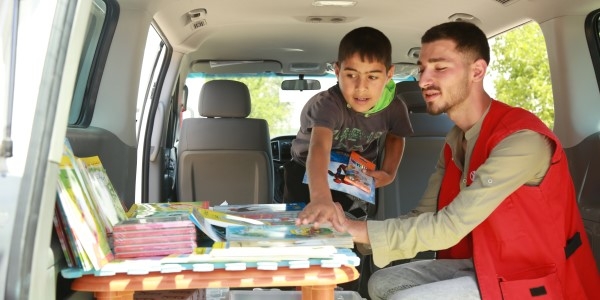 A team in Lebanon are part of a mobile library run out of a van.