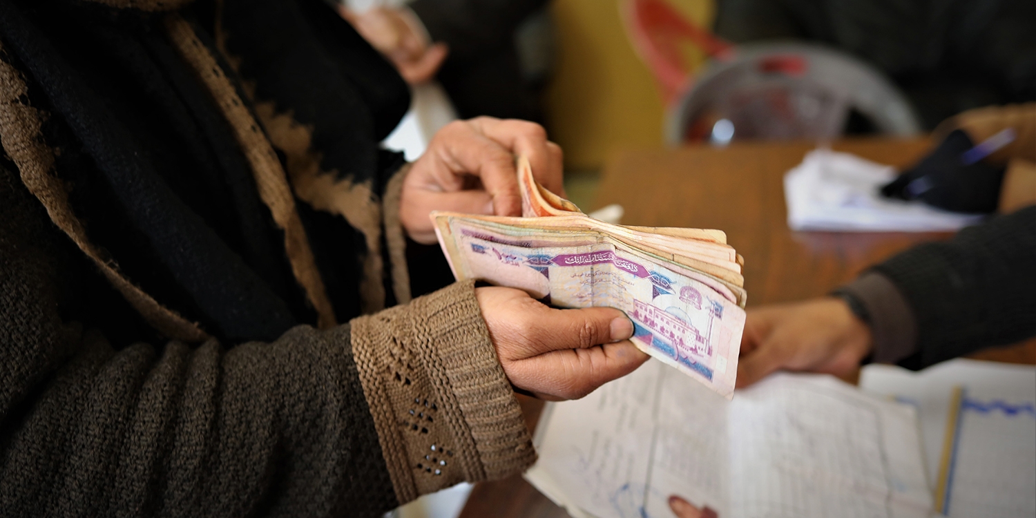 A woman, who has received cash assistance from Save the Children to help her buy essential items including food and clothing through the critical winter months.