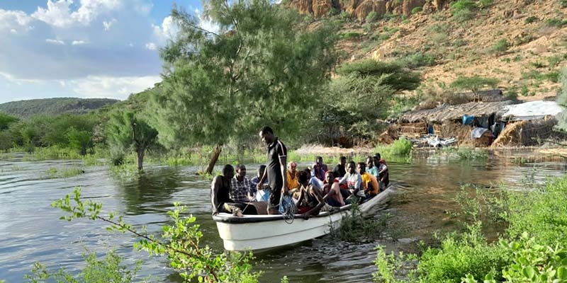Ethiopia, villagers use a boat, the only one in the village, to evacuate people to safety in Mustahil District, Ethiopia