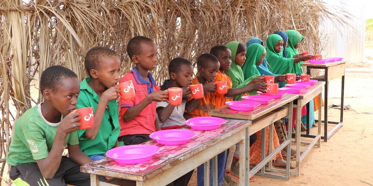   A group of children enjoys a nutritious meal supplied by Save the Children at an elementary school in the Somali Region of Ethiopia. Photo credit: Seifu Assegid / Save the Children, July 2019.