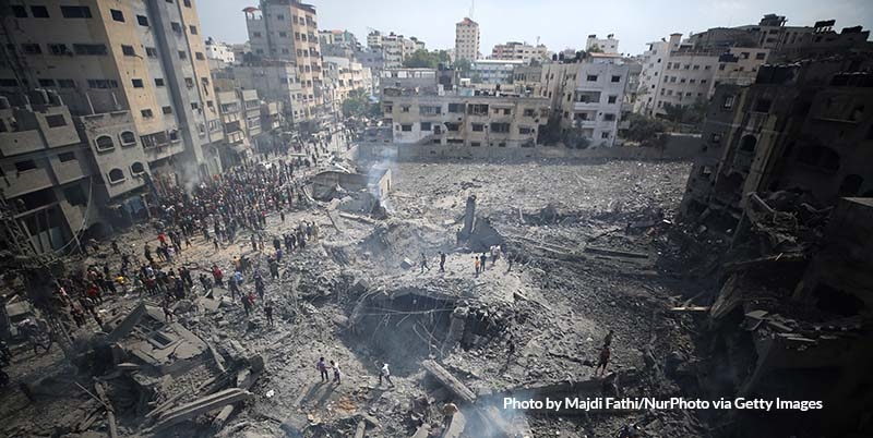 In Gaza, a boy faces a pile of rubble from buildings destroyed by the ongoing conflict. 