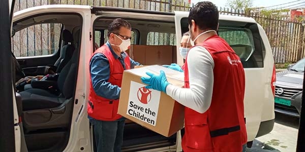 A Save the Children staff member delivers kits door to door in Beirut.