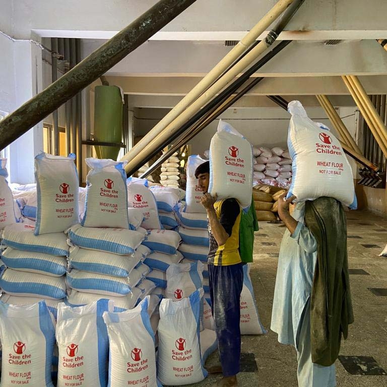 In Pakistan, bags of wheat flour are being delivered to families who have lost everything.