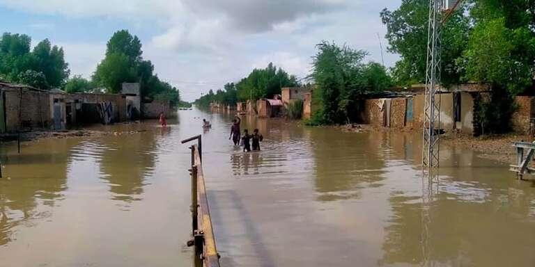 In Pakistan, flood waters fill a roadway following a record-breaking monsoon season. 