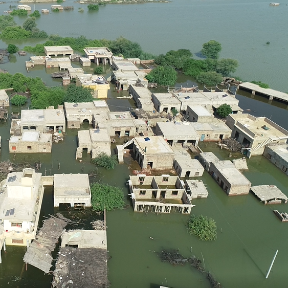 In Pakistan, flood waters fill the street after a deadly and devastating monsoon.