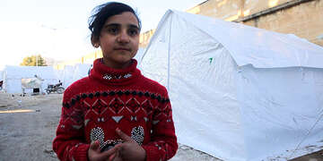 Hayat*, 10, fled Ma'arat Nu'man with her family and is now sheltering in a former playground in Idlib, NW Syria.