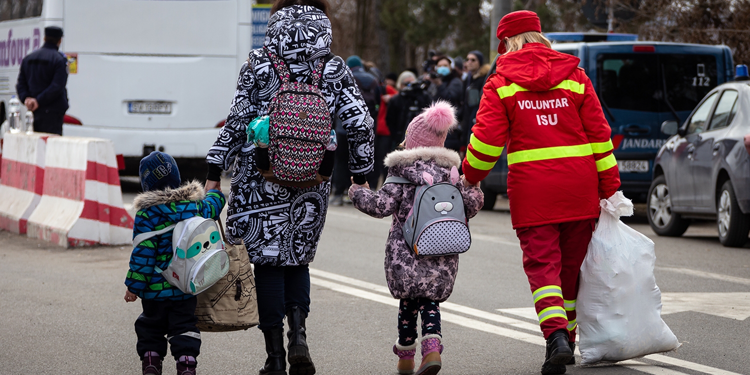 Ukraine, a Ukrainian family cross the border into Romania to escape conflict.
