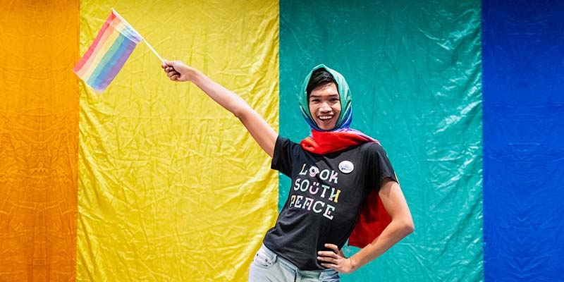 Dada, 21, is a campaigner with the Look South Peace Group in Thailand’s deep south and holds a rainbow pride flag.