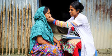 A doctor performs a home visit for a woman who lives in Bangladesh. Photo credit: Save the Children/Aug 2016