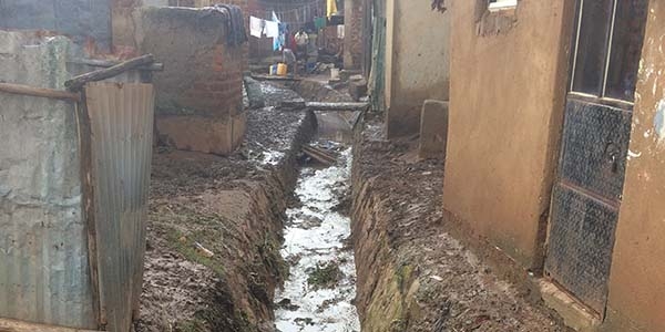 A drainage channel used for washing clothes is also where members of the community often have to dispose their waste.
