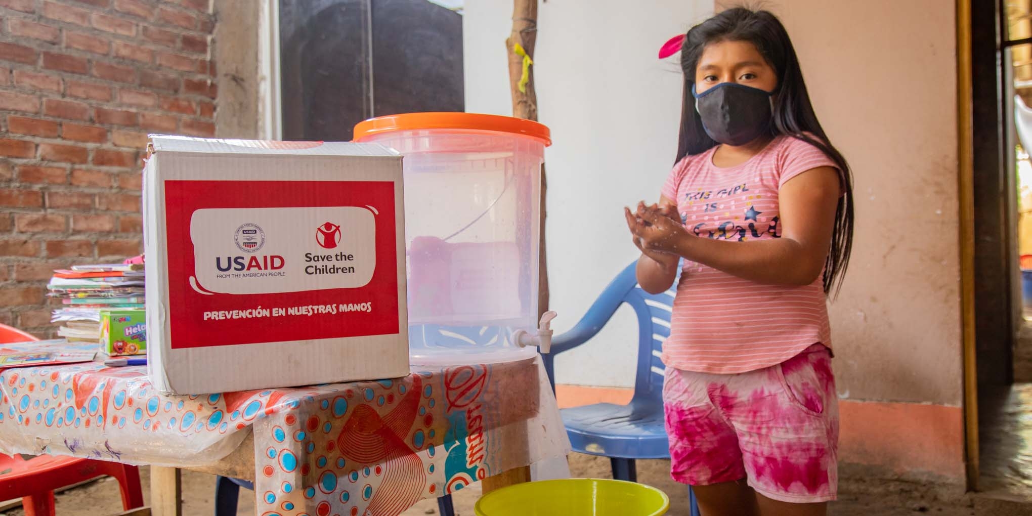 In Peru, Ariana practices handwashing and hygiene with Save the Children and USAID support.