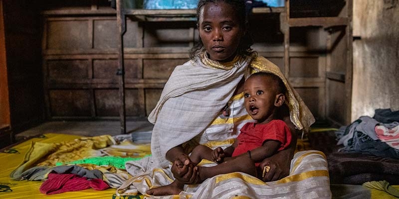 In Ethiopia, a mother and her child sit together. 