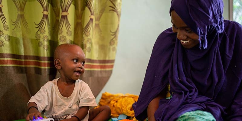 Somalia, a nine month old sits with his mother as he is treated for severe acute malnutrition at a hospital in Somalia.