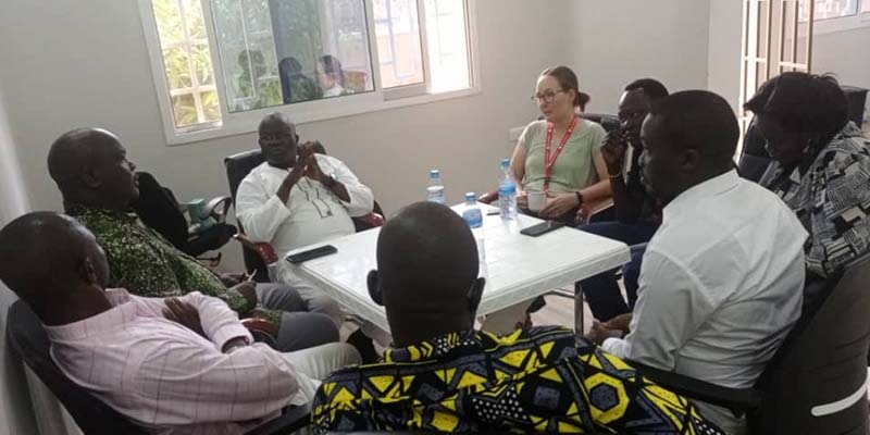 South Sudan, a Save the Children worker meets with local leaders to talk about localization