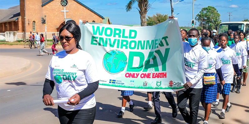 Children from the Care for Nature clubs join in a march on World Environment Day June 5