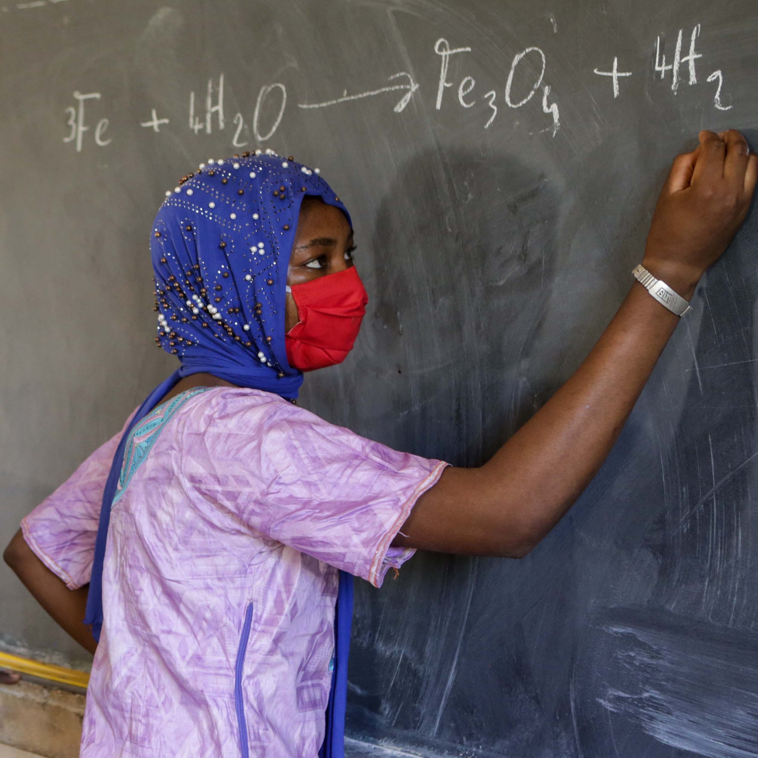 Kadidia, 14 at school in her homeland of Mali